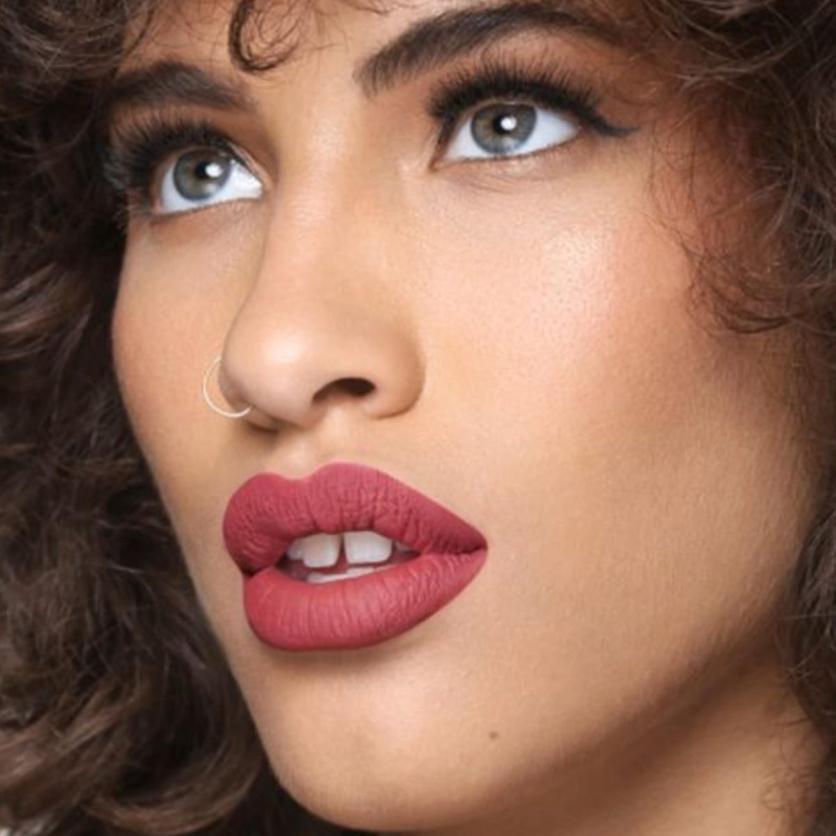 The Lip Bar Unimpressed with Juicy Pout lip care preps lips for color