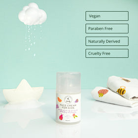The Natural and Organic Family Gentle Face Cream swatch on hand demonstrates creamy texture.
