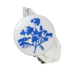 The Outset Botanical Barrier Rescue Balm tin in close-up for on-the-go hydration.