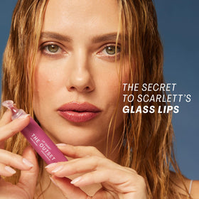 Close-up of The Outset Lip Oasis Mirage tint applicator in use.
