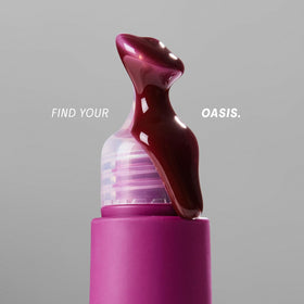 Packaging display for The Outset Lip Oasis lip balm.