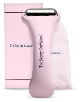 The Skinny Confidential Ice Roller with pink handle cooling puffiness and redness.