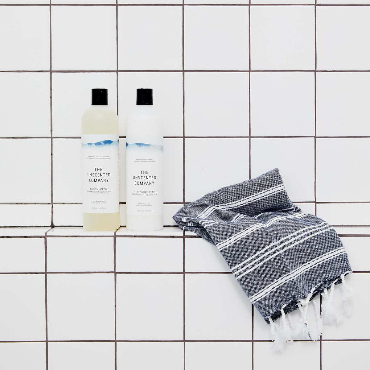 The Unscented Company Daily Shampoo applied to wet hair for a clean feel