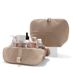 The Verti front view in sandstone shows organized pockets for quick access