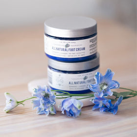 Spa-like massage with The Yellow Bird Foot Cream suggests relaxing foot care moment.