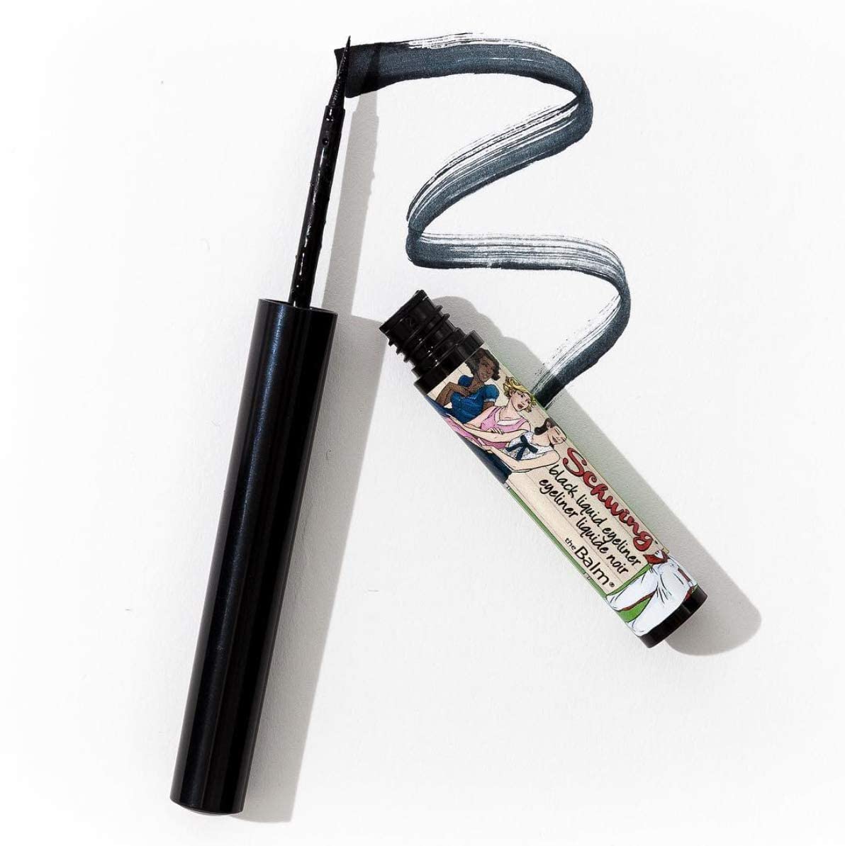 theBalm Schwing matte black finish delivers bold, smudge-resistant definition.