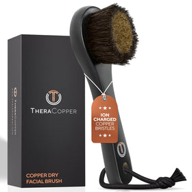 TheraCopper copper dry facial brush close-up showing copper bristles for gentle exfoliation.
