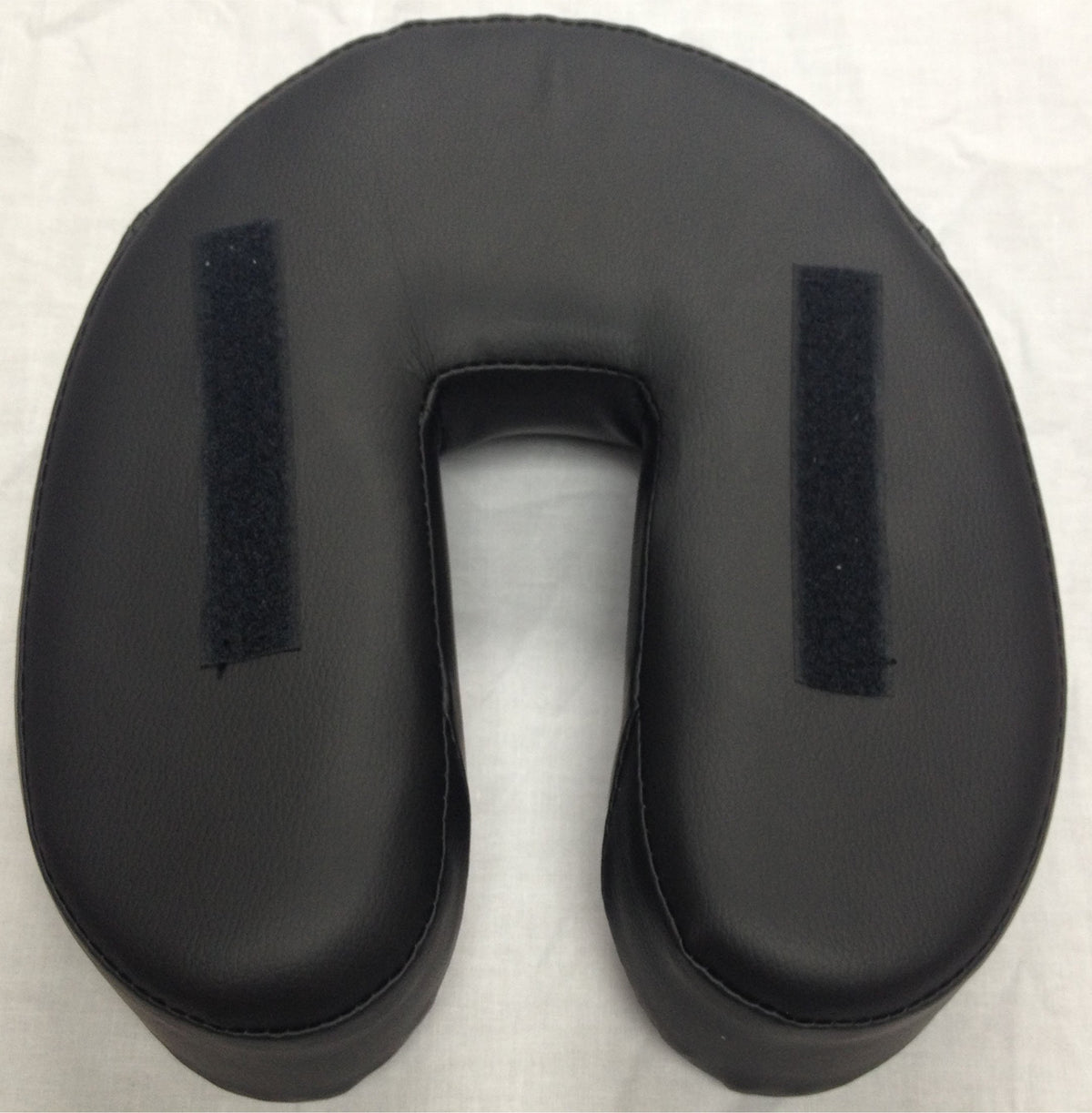 Therapist's Choice Basic Face Cradle Cushion (Black) on a table demonstrates reliable support during sessions