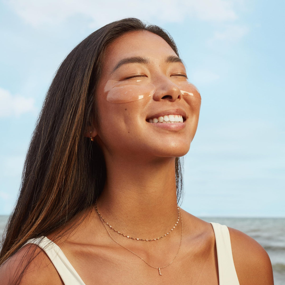 Three Ships Brighter Days eye masks application shot conveys quick, refreshing eye-area relief.
