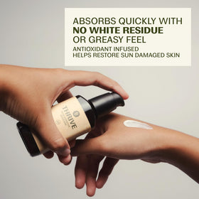 Sunscreen being dispensed onto a finger for easy layering with skincare