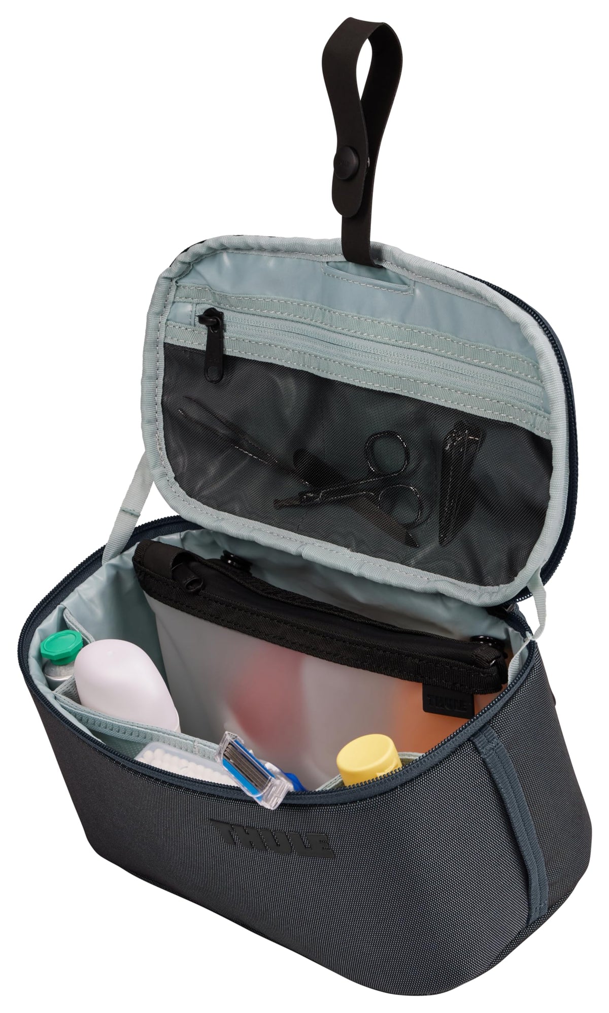 Thule Subterra 2 lid pocket with mesh panel for quick access.