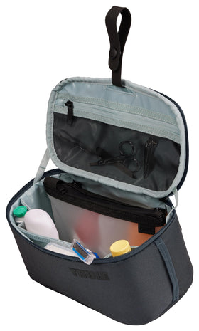 Thule Subterra 2 lid pocket with mesh panel for quick access.