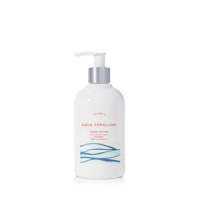 Thymes Aqua Coralline hand lotion in a silver pump bottle, quick-absorbing hydration for dry hands.