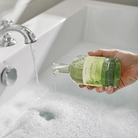 Thymes Bubble Bath Eucalyptus fragrance closeup, awakens senses with lemon, petitgrain, and fir notes.