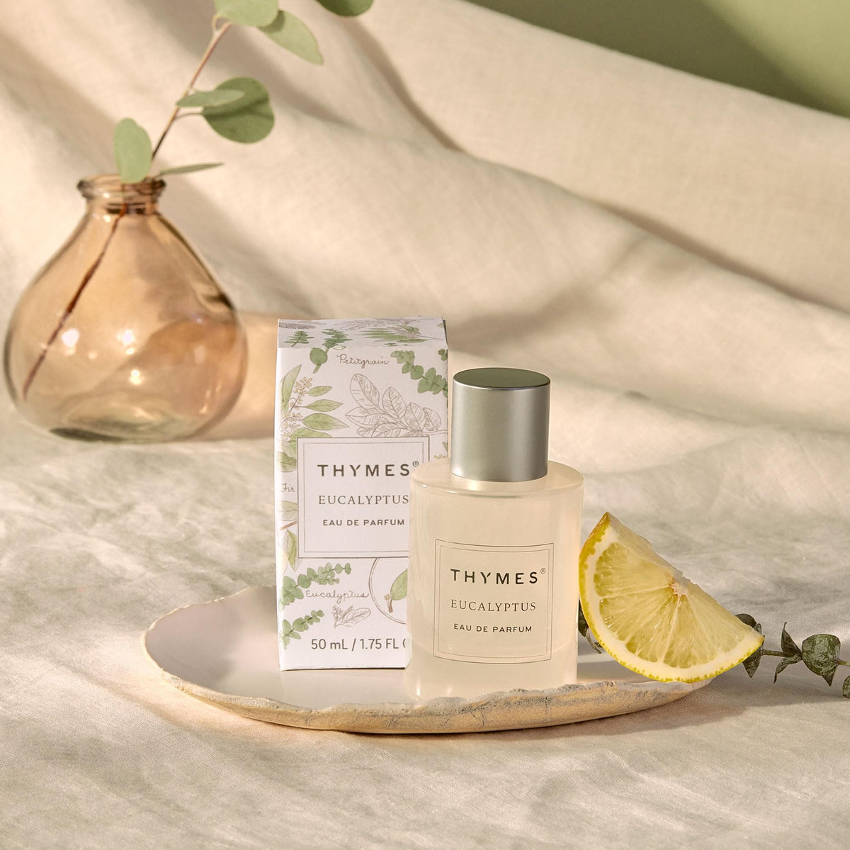 Thymes Eau De Parfum bottle close-up, showcasing the elegant cap and refined label.