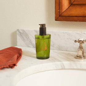 Thymes Frasier Fir label closeup highlights natural fragrance notes for holiday ambiance.