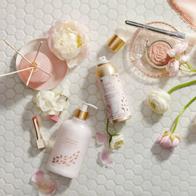 Thymes Goldleaf Gardenia foam on skin illustrating gentle cleansing.