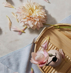 The Thymes Kimono Rose floral bouquet scene suggests gift-ready appeal.