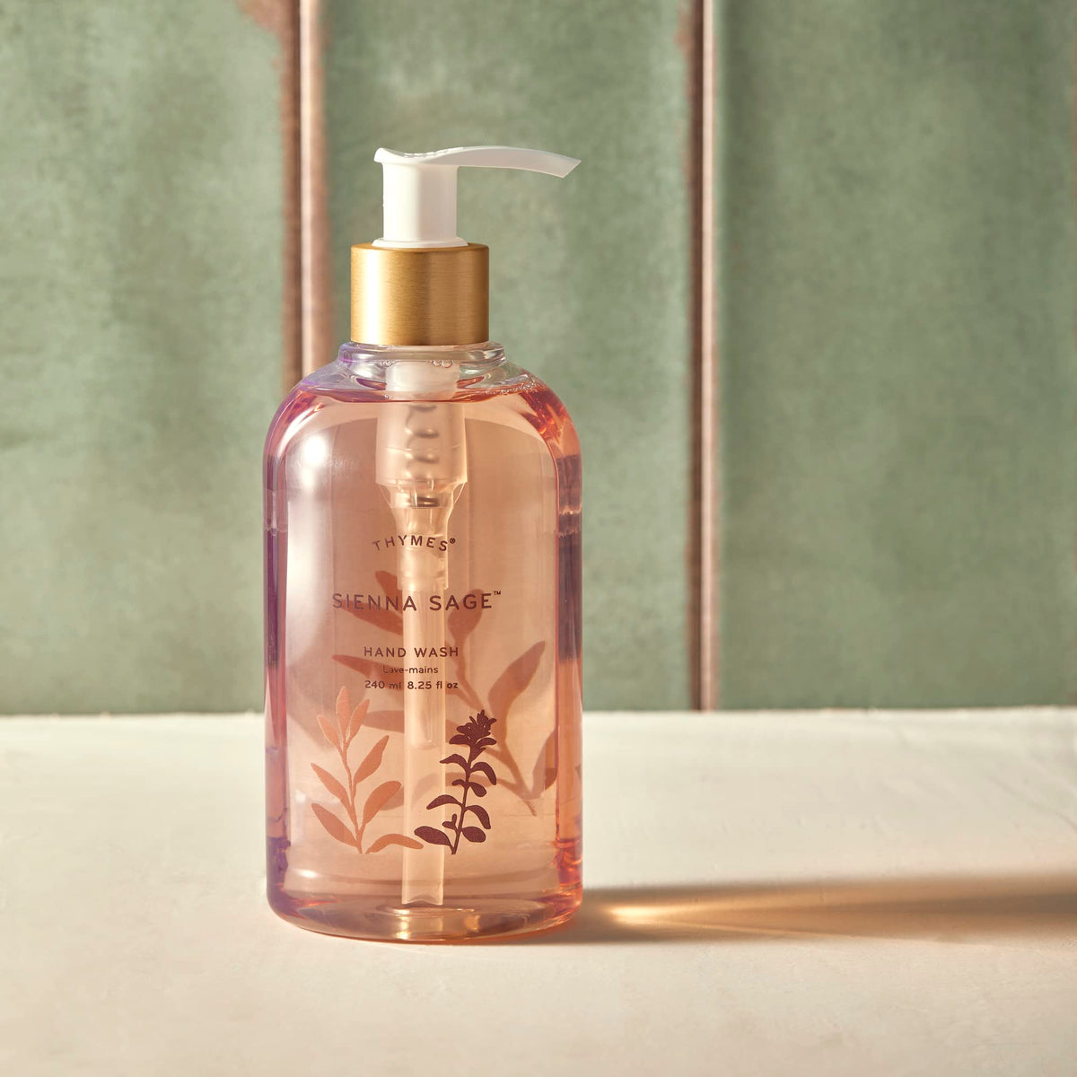 Thymes hand wash bottle close-up highlights sleek pump and clean design.