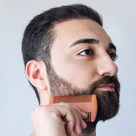 TIENQI stainless steel beard comb for even oil distribution.