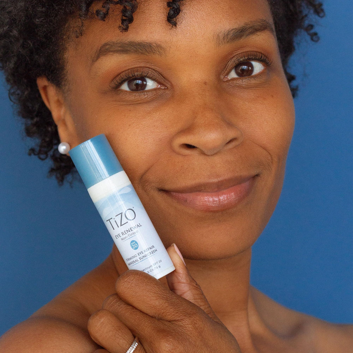 TIZO Eye Renewal under-eye application showing gentle coverage and makeup prep.