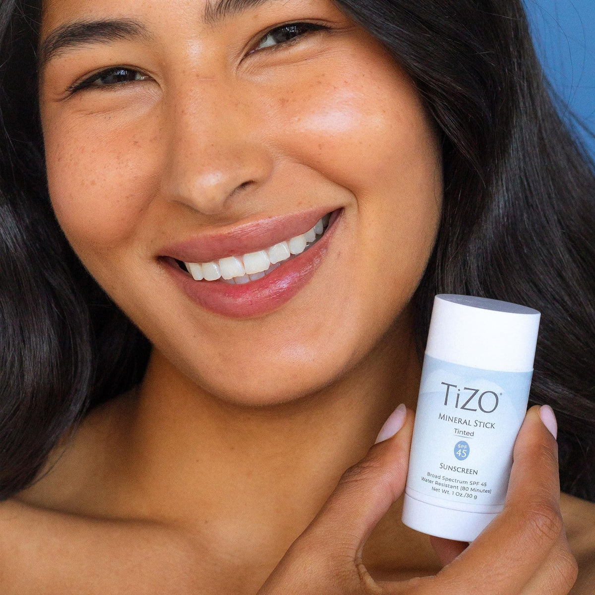 TiZO mineral stick tinted SPF 45 provides broad-spectrum UVA/UVB protection on skin.