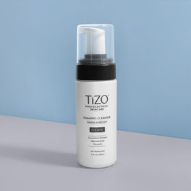 TIZO Photoceutical Foaming Cleanser packaging and 4 oz bottle on counter for easy access.