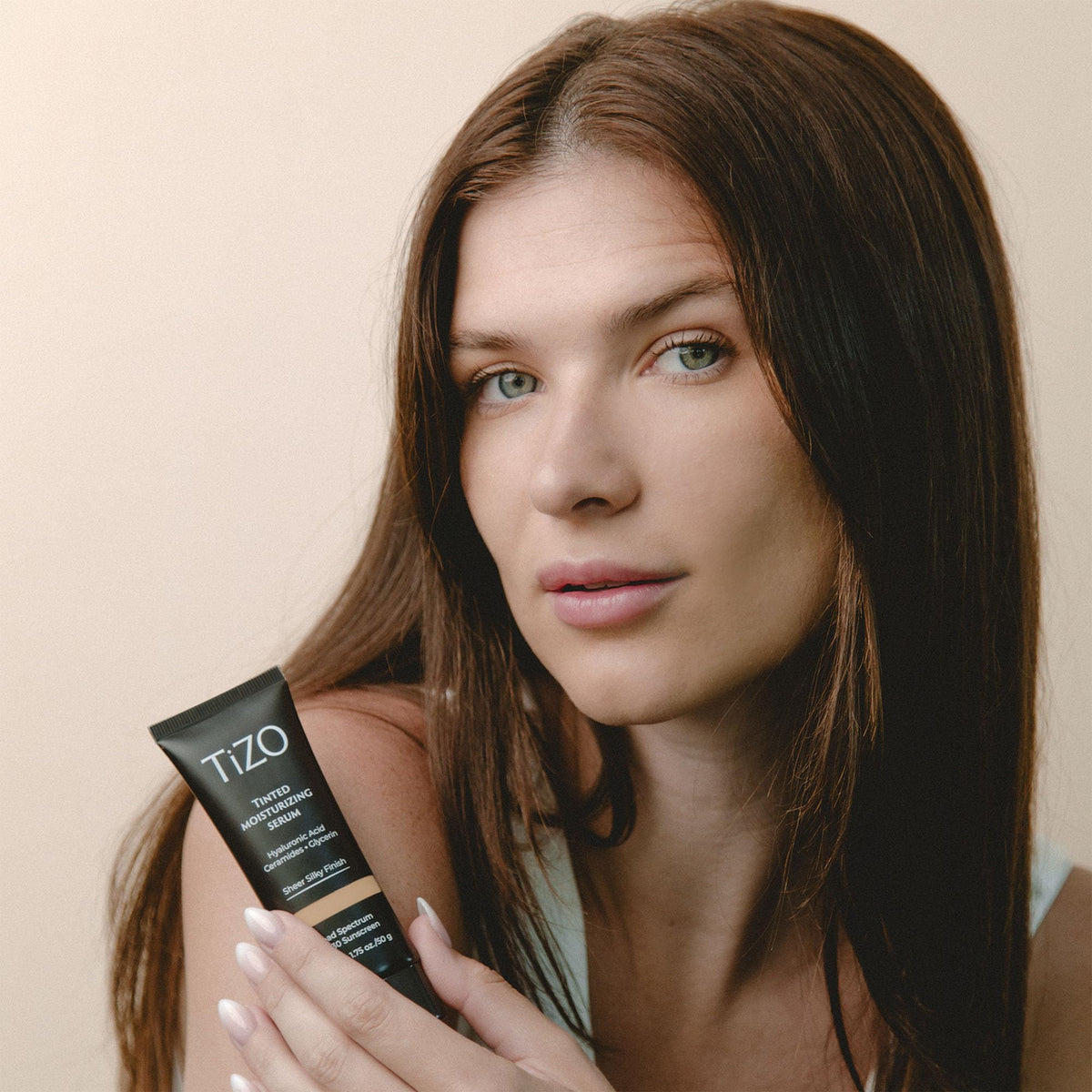 Close-up texture of TIZO serum highlighting light, antioxidant-rich formula