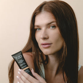Close-up texture of TIZO serum highlighting light, antioxidant-rich formula