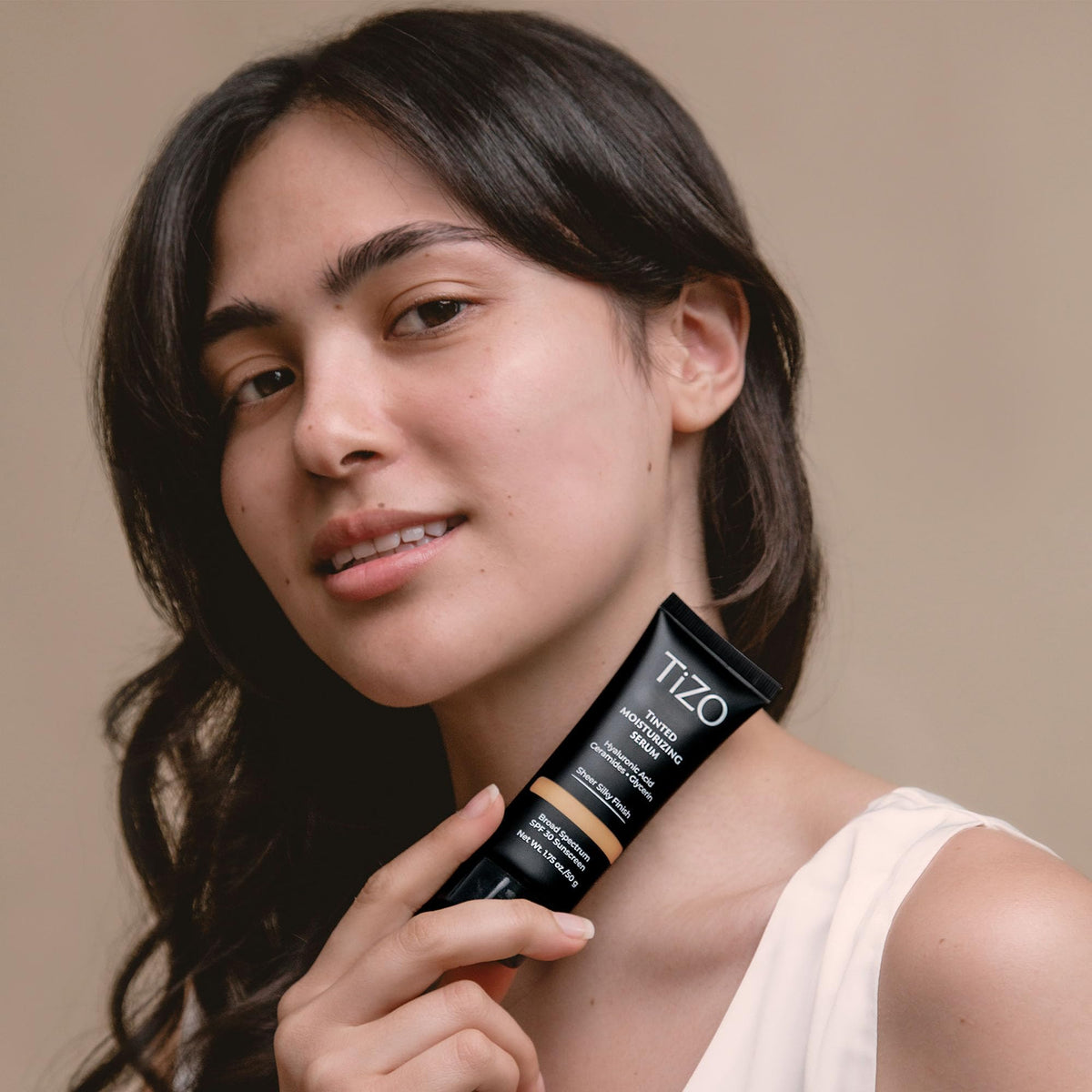 TIZO tinted serum swirl shows natural coverage for a balanced glow.