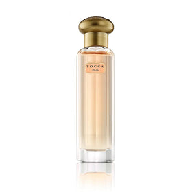 TOCCA Stella bottle close-up highlights vibrant blood orange and freesia notes