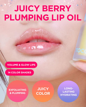 Application close-up of TOCOBO Glam Max Lip Oil 00 Frozen Berry with smooth glide.