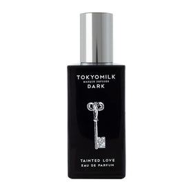 TOKYOMILK Dark Tainted Love bottle on a reflective surface, bold evening scent