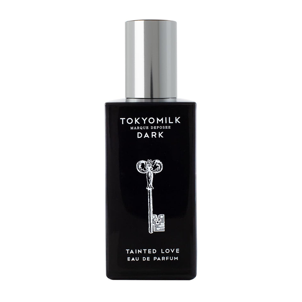 TOKYOMILK Dark Tainted Love bottle on a reflective surface, bold evening scent