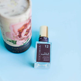 TOKYOMILK Gin & Rosewater on a dress-ready display suggesting day-to-night wear.