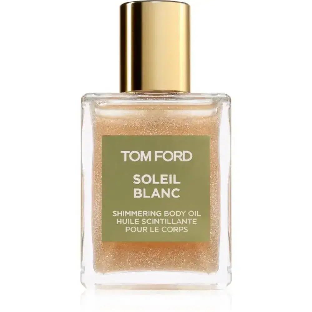 Tom Ford Soleil Blanc shimmering body oil mini bottle provides radiant glow and subtle fragrance.