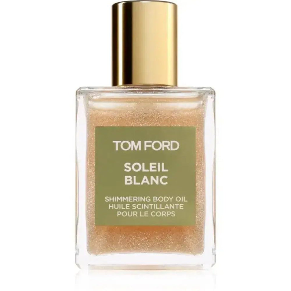Tom Ford Soleil Blanc shimmering body oil mini bottle provides radiant glow and subtle fragrance.