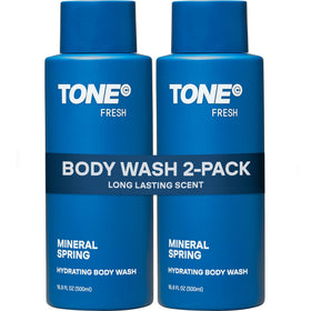 TONE Exclusive Hydrating Body Wash bottle on shelf highlighting fresh scent.