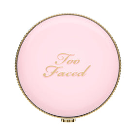 Too Faced Moon Crush Highlighter glow like reflective liquid on skin.