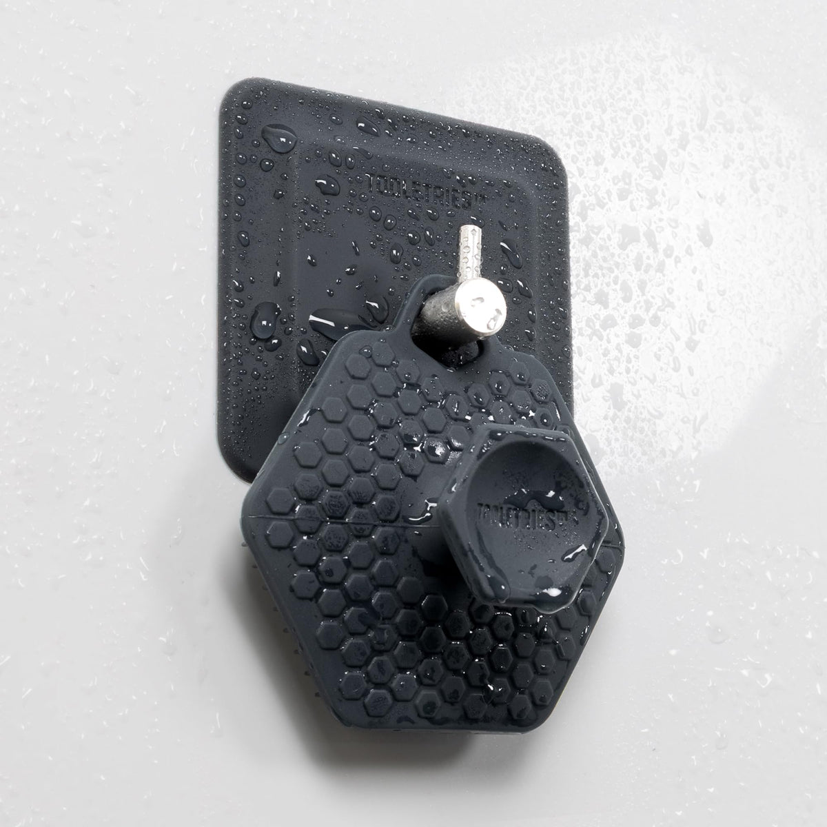 TOOLETRIES Men’s Face Scrubber 2.0 charcoal detail highlighting color and texture