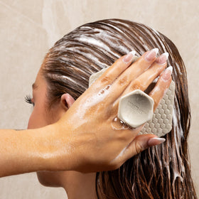 TOOLETRIES scalp scrubber ergonomic handle for easy grip during shower.