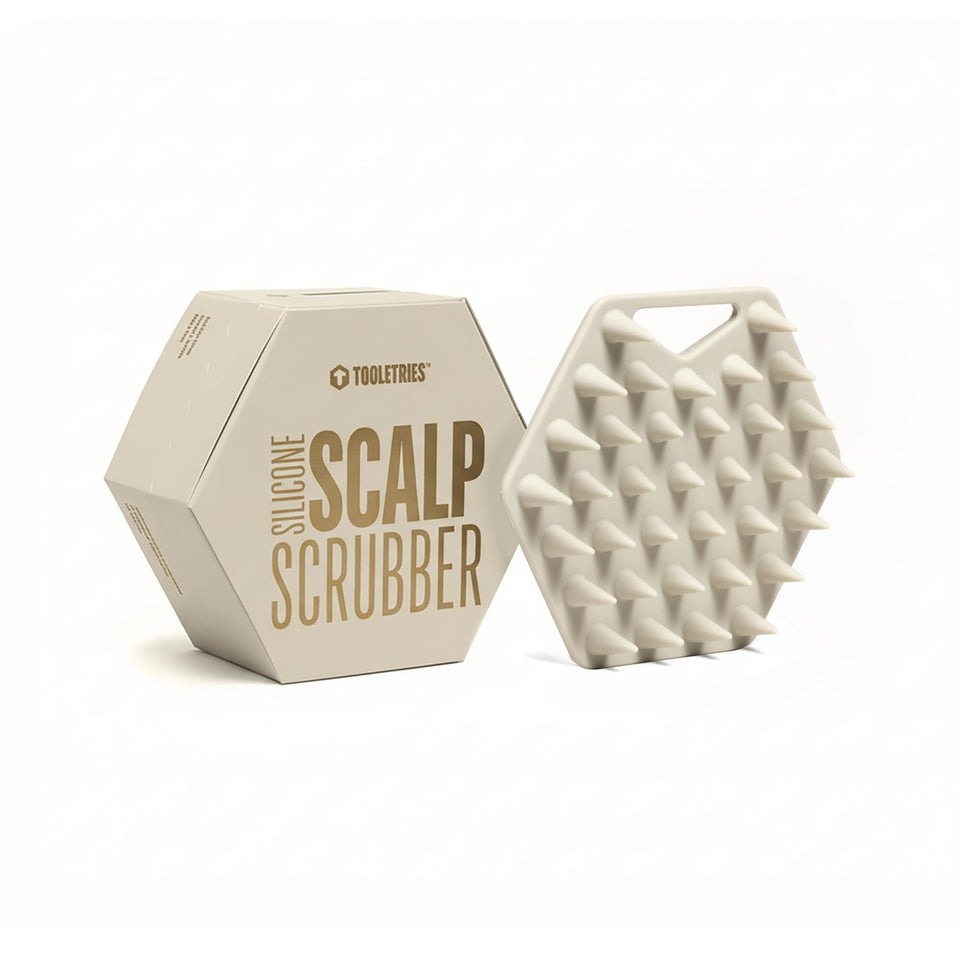 TOOLETRIES scalp scrubber with silicone bristles for gentle exfoliation and scalp stimulation.