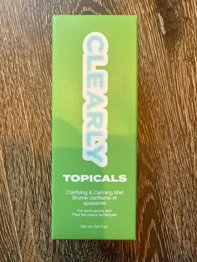 Topicals Clearly Acne Mist dispensing pump shows easy spray application.
