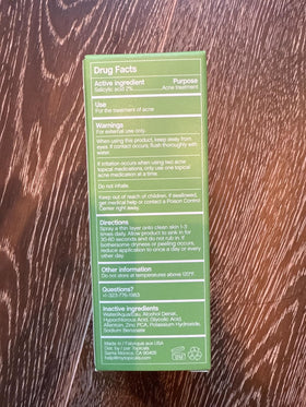 Topicals Clearly Acne Mist used on the forearm for body care routine.