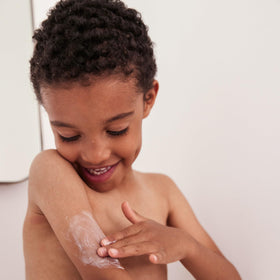 Topicrem Atopic Skin AD Emollient Balm application, smooth cream glides on irritated areas with comfort.