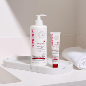Topicrem Atopic Skin AD Emollient Balm ingredients list, includes relipidising components to support skin resilience.