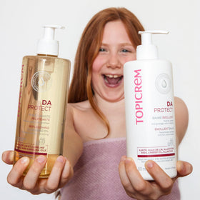 Topicrem Atopic Skin AD Emollient Balm packaging side, dermatological and paediatric suitability for family use.