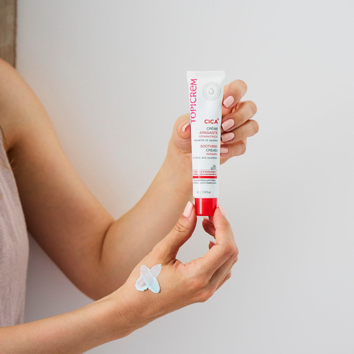Topicrem Essentials CICA Repair Cream on the body for versatile use.