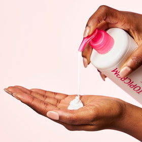 Topicrem Ultra-Moisturizing Body Milk on-skin application shows instant hydration and softness