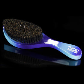 Close view of Torino Pro #88 long bristles for targeted hair guidance.